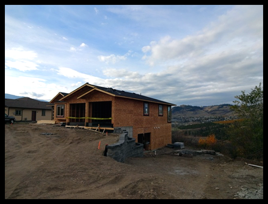 Building a Home in Coldstream, Third Month, asphalt shingles have been installed.